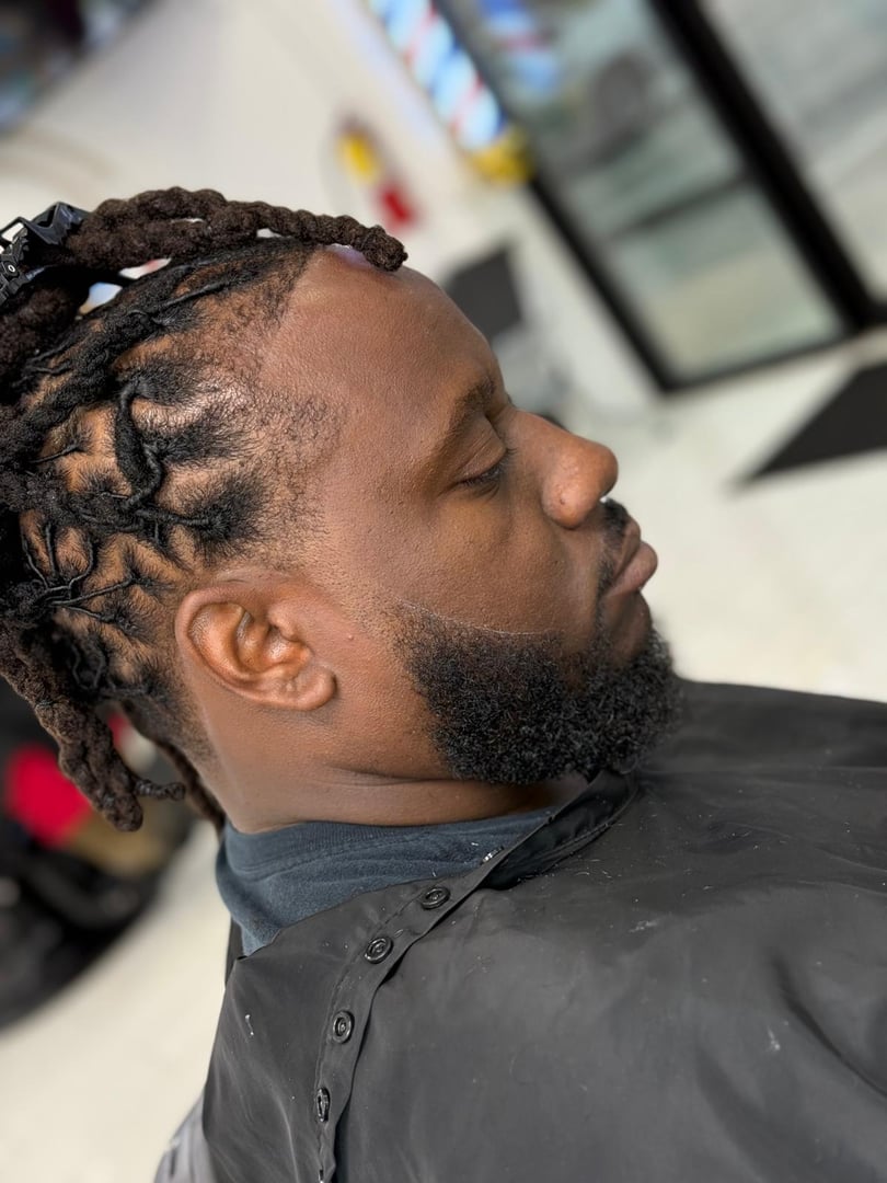 A clean fade and shaped beard featured by Danis Barbers at 4317 Ogeechee Road